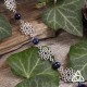 Bracelet poétique et zen orné de délicates Fleur de Vie argentée et ajourées entourées de perles en Lapis Lazuli bleu nuit.