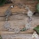 Bracelet poétique et zen orné de délicates Fleur de Vie argentée et ajourées entourées de perles en Fluorite blanche et verte.