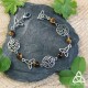 	Bracelet féerique art nouveau Kalya volutes elfiques argentées triquetra médiéval celtique et Oeil de Tigre brun