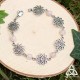 	Bracelet poétique et zen orné de délicates Fleur de Vie argentée et ajourées entourées de perles en Quartz Rose pastel.