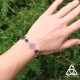 Bracelet poétique et zen orné de délicates Fleur de Vie argentée et ajourées entourées de perles en Améthyste violette.