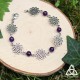 Bracelet poétique et zen orné de délicates Fleur de Vie argentée et ajourées entourées de perles en Améthyste violette.
