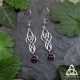Boucles d'oreilles médiévales pendantes aux volutes elfiques et entrelacs argentés terminées par une Améthyste violette