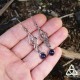 Boucles d'oreilles médiévales pendantes aux volutes elfiques et entrelacs argentés terminées par une Améthyste violette