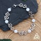 Bracelet médiéval et féerique Faerell orné de Spirales argentées entourées de perles de Cristal de Roche blanc craquelé.