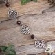 	Bracelet médiéval féerique Arabesques et volutes elfiques rondes entourée de perles de Grenat rouge foncé