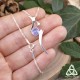 Collier médiéval fantasy en argent 925 ruban elfique ondulant autour d'une Tanzanite bleu clair pour mariage féerique