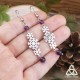 Boucles d'oreilles pendantes en acier inoxydable ornées de flocons de neige argenté entourés de perles en Améthyste violet foncé