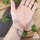 Bracelet de main Meredith en acier inoxydable - vue arrière sur fermoir réglable, porté sur main de femme, style ésotérique