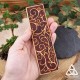 Marque page artisanal en cuir Valaryn  tenu dans la main pour voir la taille réelle - cadeau féerique pour Noël, style grimoire